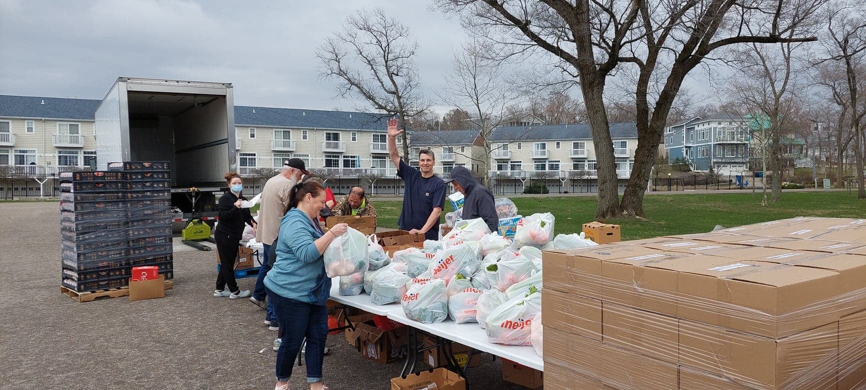 Volunteers prepare and distribute rescued food to local residents through a community food outreach program.