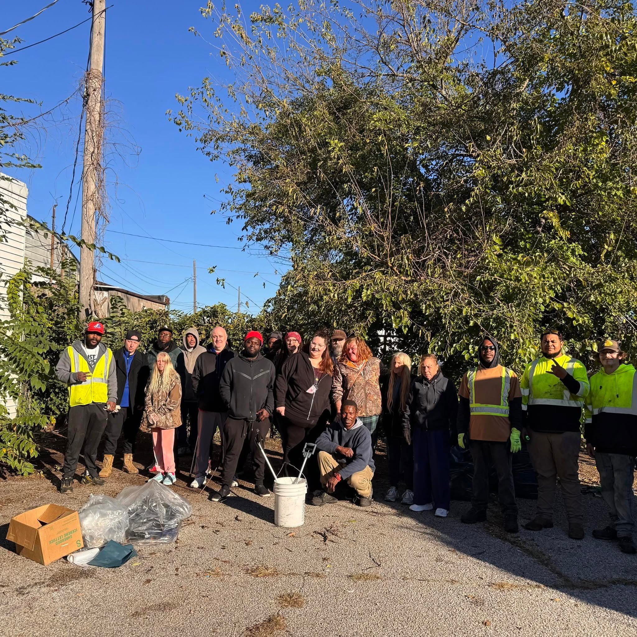 Volunteers and community members participate in a neighborhood cleanup project to improve local spaces and promote community pride.